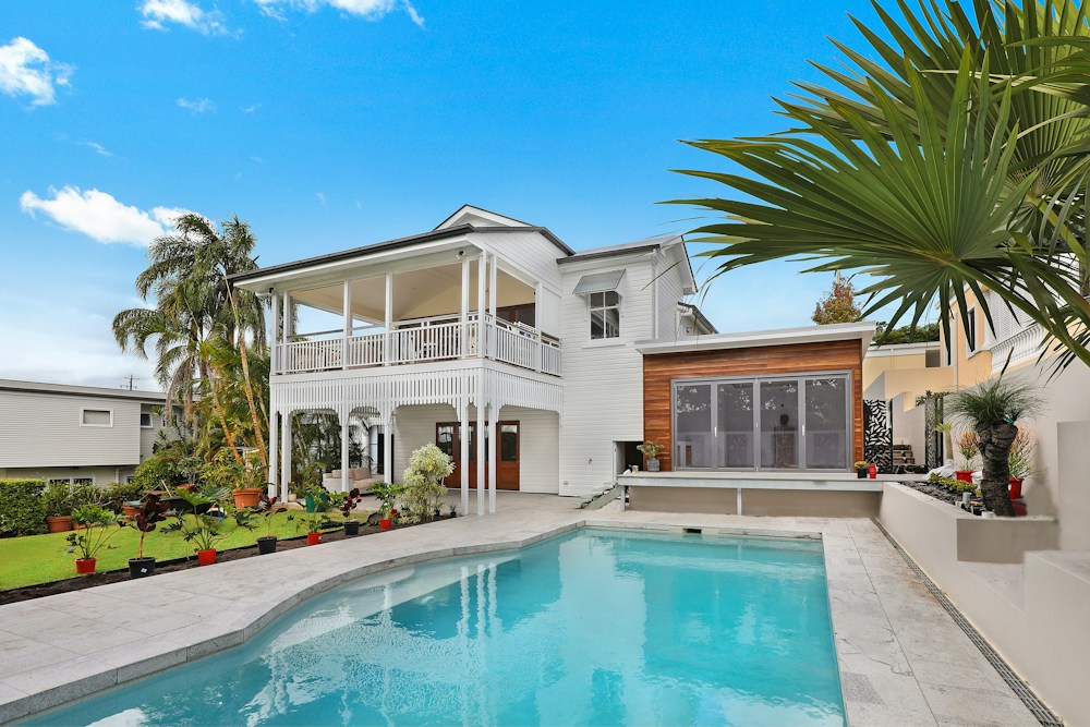 Illustrative luxury house with a balcony and outdoor pool