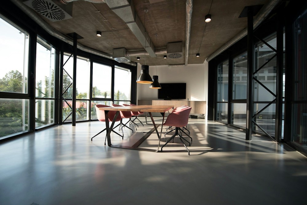 Illustrative office meeting area with large windows